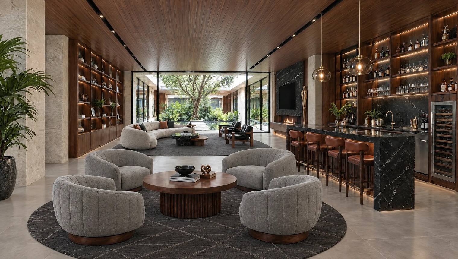 Sculptural bouclé chairs around a stone table framed by tropical greenery